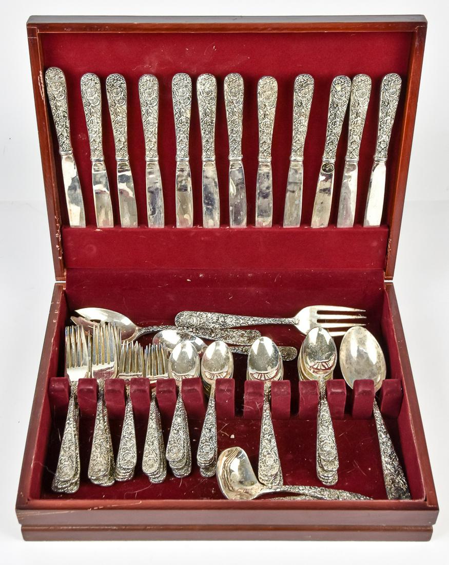 Godinger Repousse Plated Flatware Set: Service for twelve with diner forks, tea spoons, dinner knives desert forks; 11 table spoons, gravy ladle; meat fork serving spoon sald serving spoon and sauce ladle, in fitted wood box. Condition a f