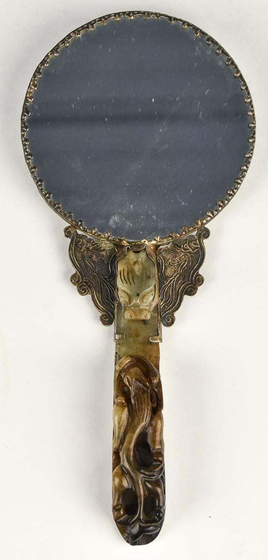 Beautiful Early Chinese Carved Jade Belt Hook: Mounted as a small hand mirror. The green to brown variegated jade is carved with dragon head hook at top and wingless dragon on lower half. Hook is about 1" wide and deep and 5" long. The mirror is 1