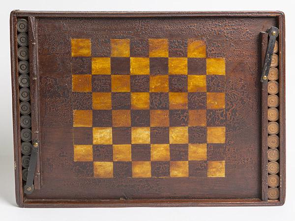 Outstanding Early Wood Checkerboard With Old Paint: In original red & white painted finish with wonderful original old alligator finish, original turned maple checkers in natural and black in compartments at ends of board with ingenious steel & wood sp