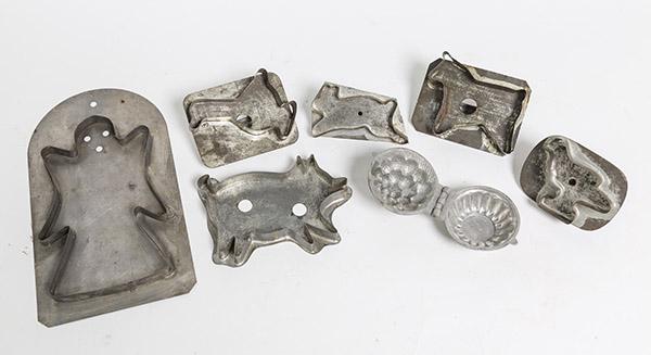 Early Cookie Cutters Plus: Lot of 7 including 6 cutters in the form of rabbit, bird, goose, horse, pig & ghost, smallest is 4" long, largest 10" high; and a small pewter ice-cream mold, fruit basket, 3" long. Condition all Fine
