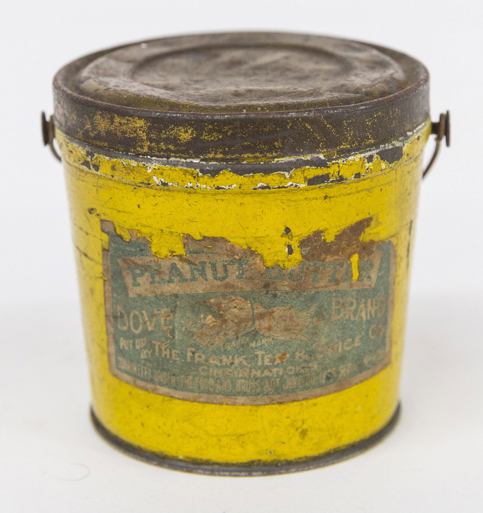 Dove Brand Peanut Butter Tin Pail: Chromolithographed paper label on yellow painted ground with Peanut Butter Dove Brand Th Frank Tea & Spice Co. Cincinnati, Ohioâ€¦ with wire bale handle, 3 1/2" diameter & high. Condition top of l