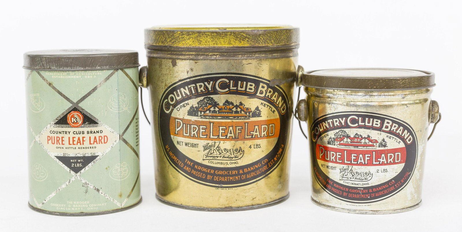 Country Club Pure Leaf Lard Cans: All chromolithographed tin, including two with wire bale handles, 5" diameter x 4 7/8" high & 6" diameter x 6 1/2" high; and one with double sided label and stamped lid with text, 4" diameter x 5 3/4"