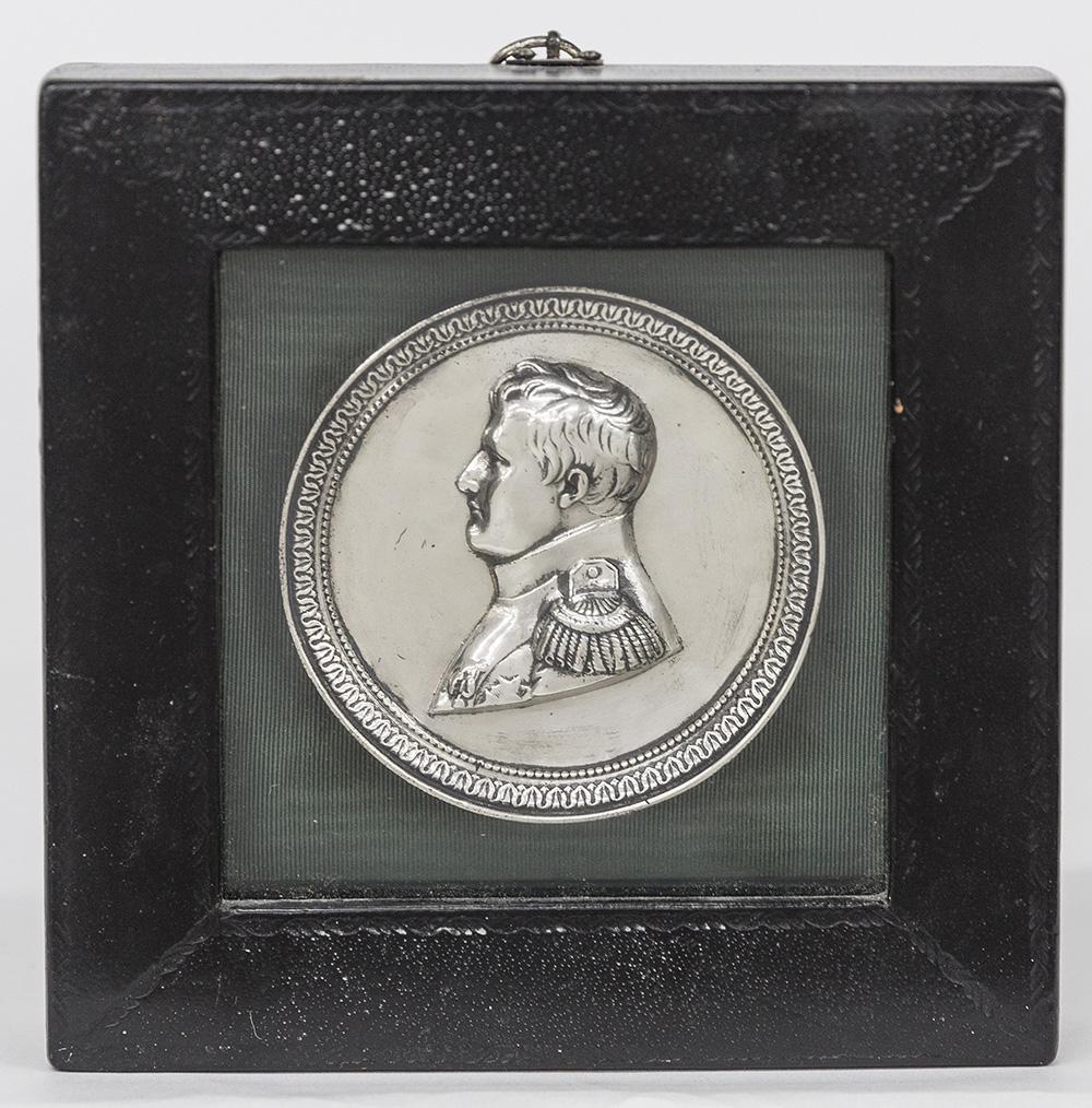 Solid Sterling Silver Medallion of Napoleon: Appears to date to 1st quarter of the 19th century, 3 3/8" diameter and mounted in square black tooled leather shadow box frame, 6 1/4" square. Unmarked , tested sterling silver. 3.15 ozt. Condition F