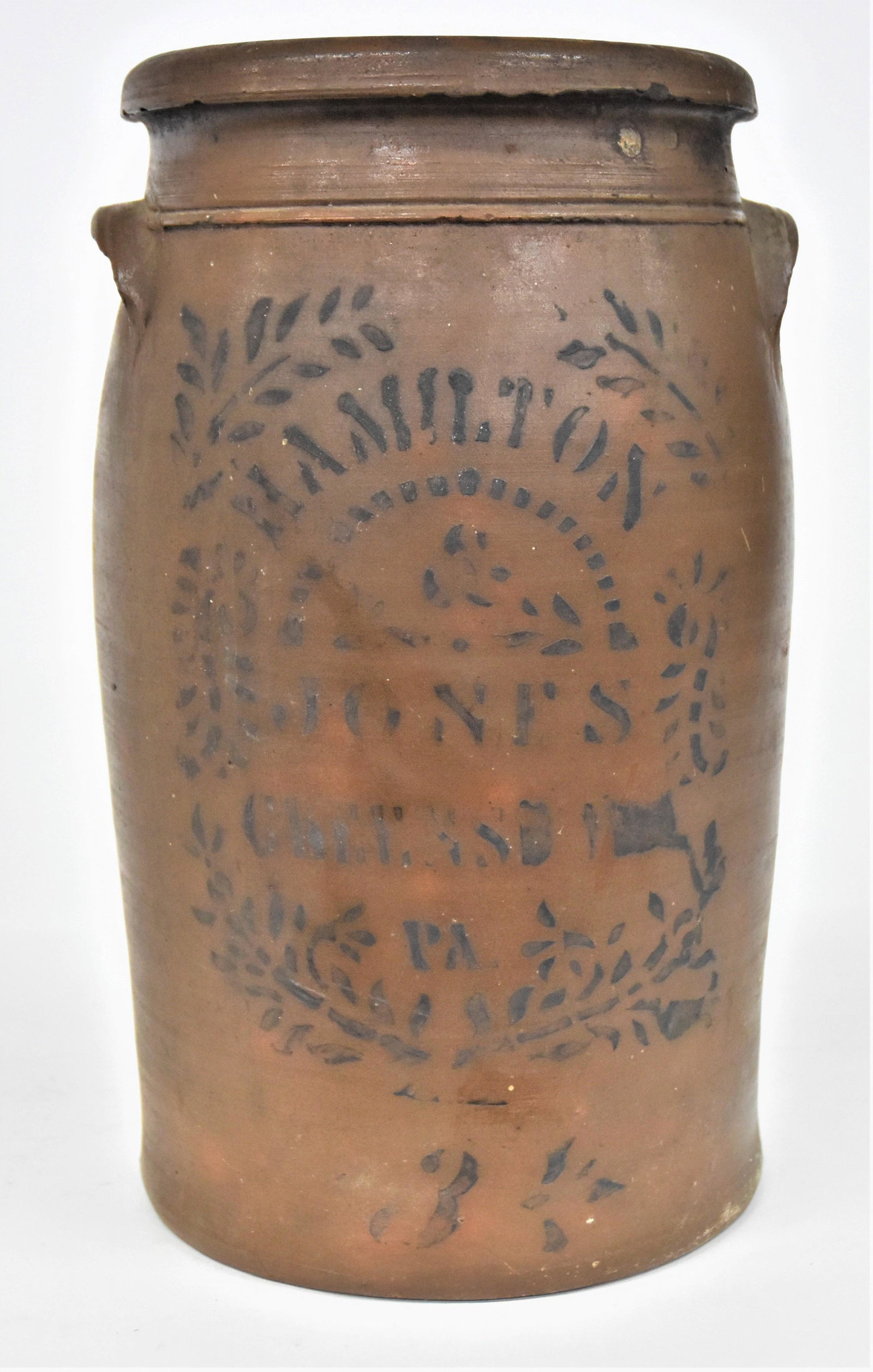 Hamilton & Jones Stoneware Jar: Salt glaze with stenciled cobalt decoration with Hamilton & Jones Greensboro Pa. with laurel wreath surround and painted cobalt 3 below, paired semi-lunate handles, on slightly ovoid form with flared 