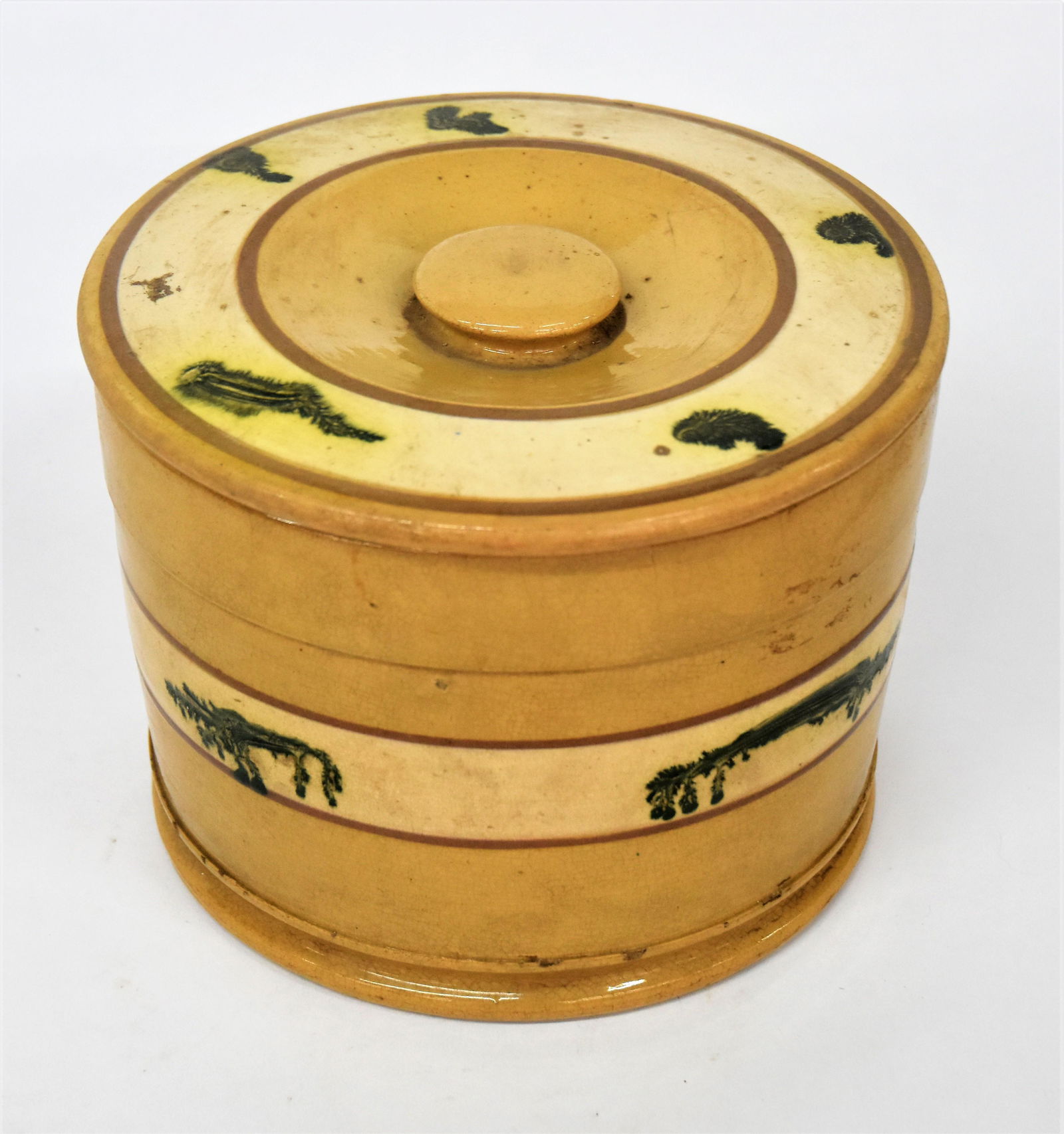 East Liverpool Ohio Decorated Yelloware Covered Jar: Attributed, unsigned, found in Highland County, straight sided jar with cream colored band on lid and body with green dendritic (sea weed ) decoration, bordered by brown annular banding, sunken turned
