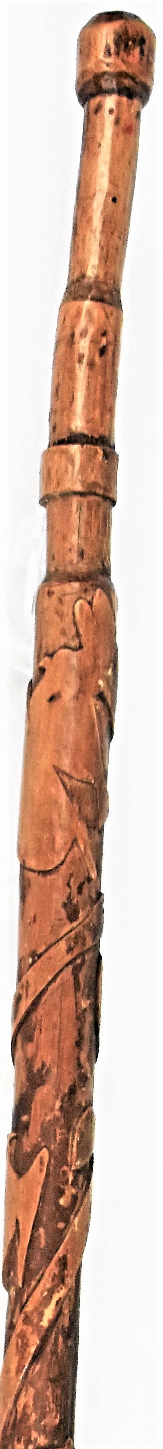 Folk Art Carved Walking Stick: Circa 1870's single piece of basswood (linden tree) with relief carved spiral vine with leaves and birds, shield, hearts and fish, carved stepped grip, never has a ferrol, knob top, all in fine old po