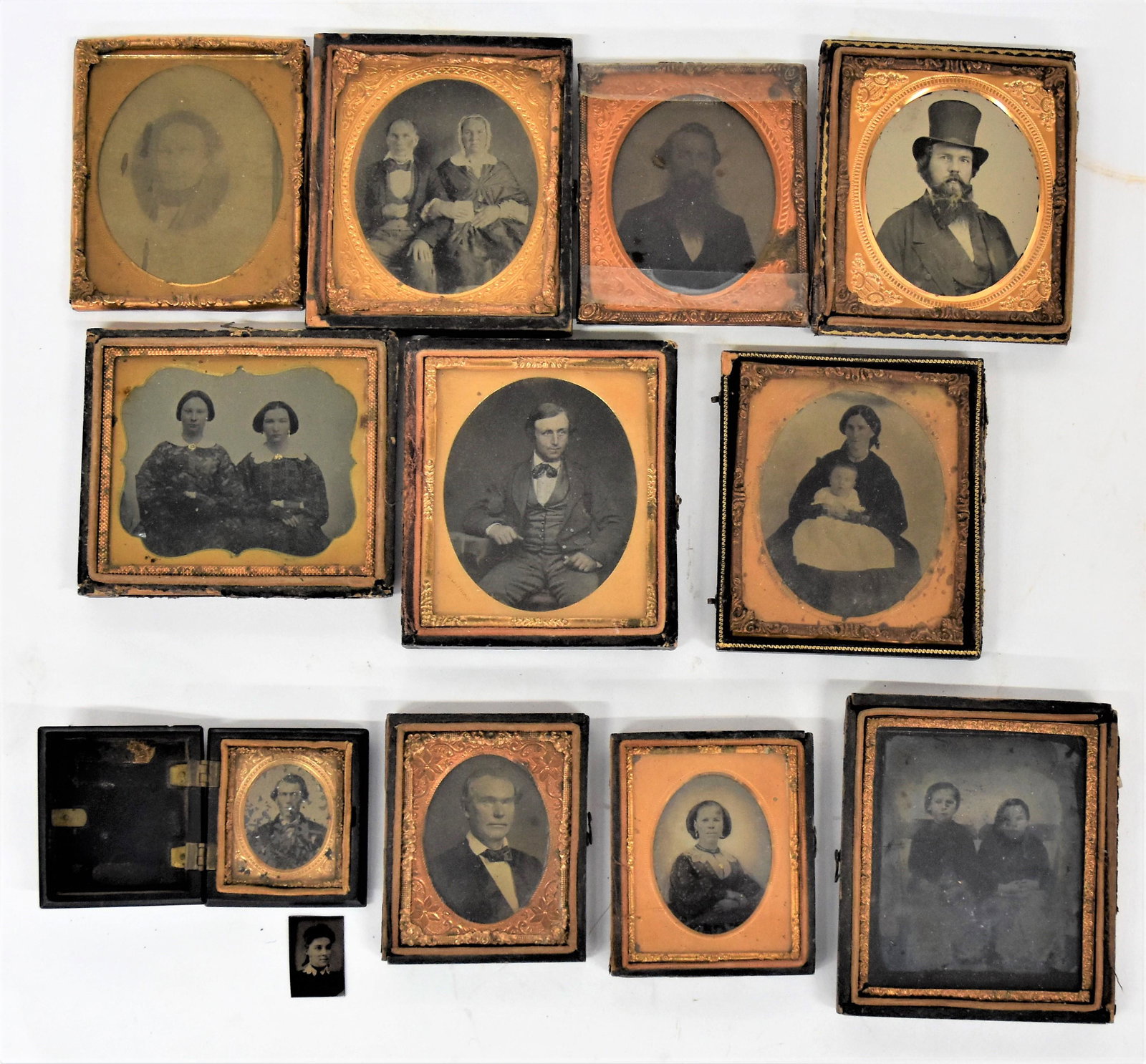 Turner Family Photographs: Lot of 13, all from the Leesburgh, Highland County, Ohio Turner family, including one sixth plate ambrotype of young gentleman with brass matt stamped Bowman 65 Jamaica St.in half case; plus two other