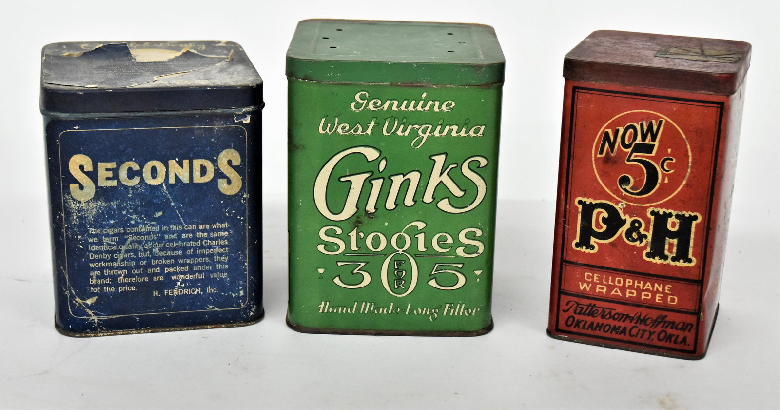 Three Early Cigar Tins: All chromolithographed with friction lids, including P&H, Patterson & Hoffman, Oklahoma City, Okla., 3 1/2" square x 6 1/4" high; plus Ginks Stogies, 4 1/2" square x 6" high; and third with chromo pap
