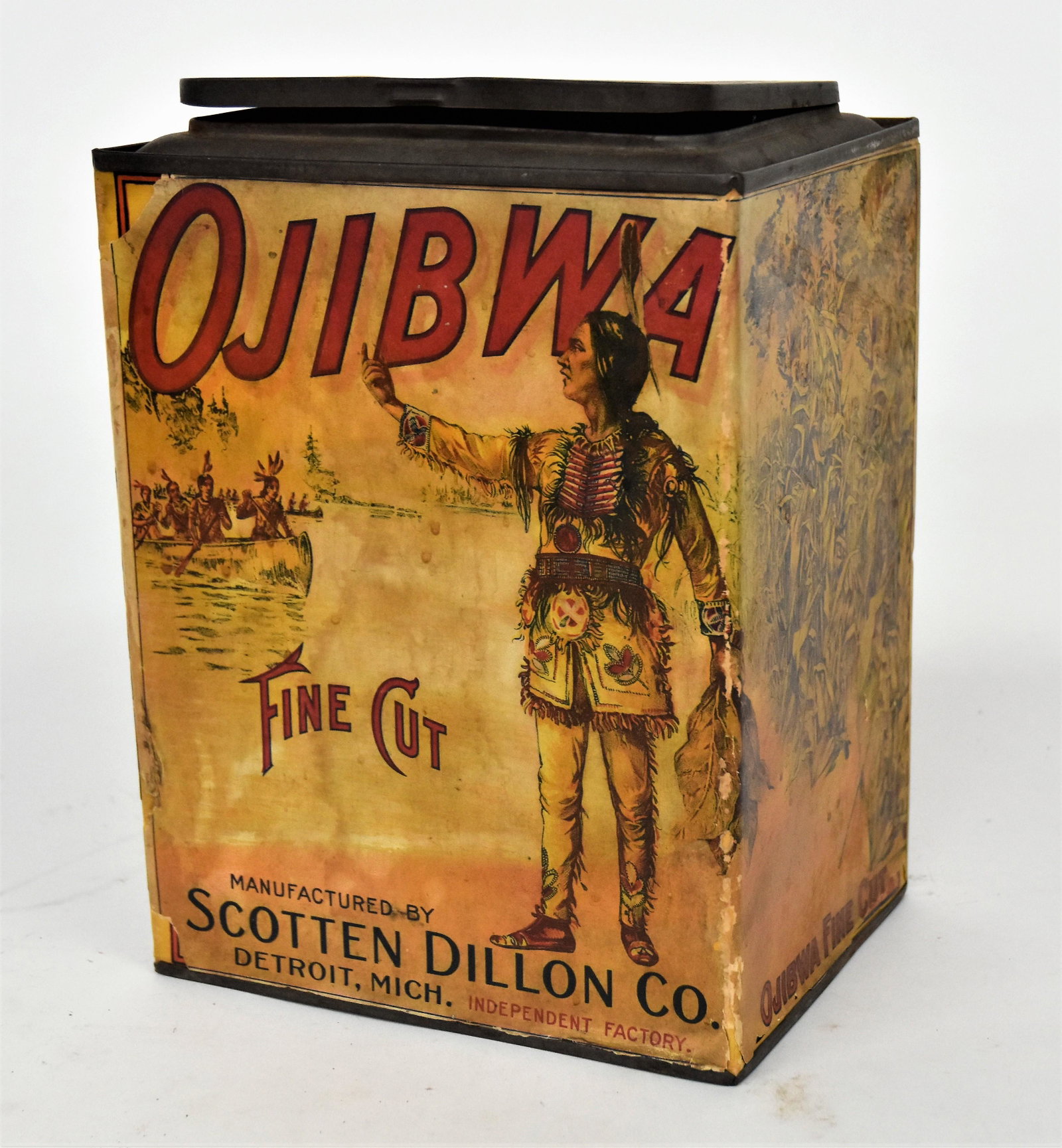 Ojibwa Tobacco Counter Top Bin: Chromolithographed paper label with Native Americans in landscape on tow sides and field corn on the other two, Scotten Dillon Co. Detriot, with hinged lid, 8 x 6 1/2 x 11". Condition chips at corners