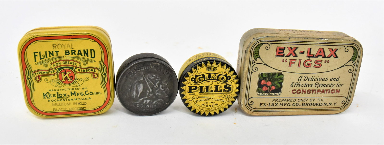 Medical Tins: Ex-Lax Figs; Gino Kidney Pills; Flint Brand Typewritter Ribbon and Russian Salve, all but last chromolithographed, largest is 4" long. Condition All Very Good to Fine.
