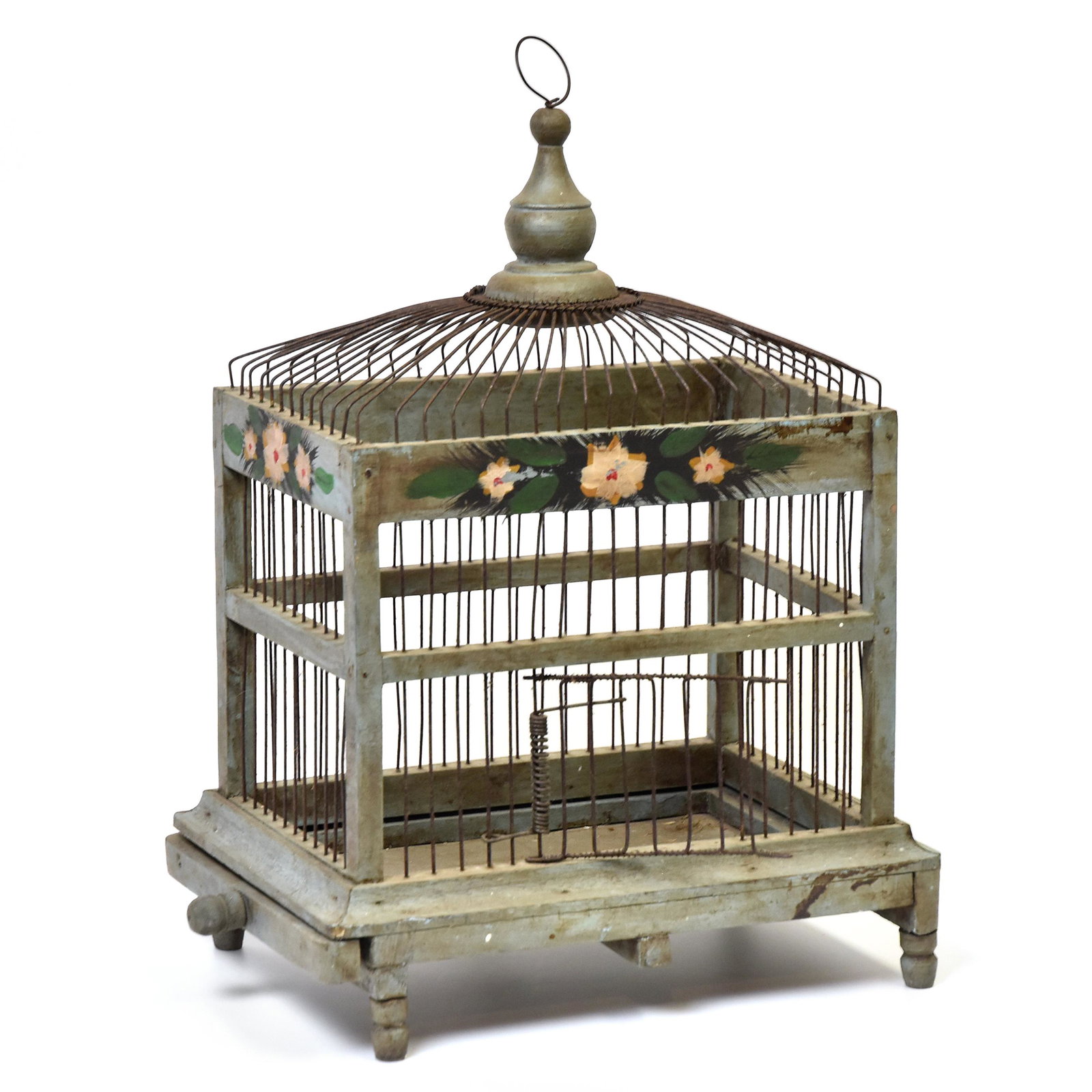 Early Painted Bird Cage: Steel wire and mixed woods with turned finial with wire hanging ring, turned legs and single wire spring loaded door in old polychrome paint with flowers and leaves, sliding shelf at base for cleaning