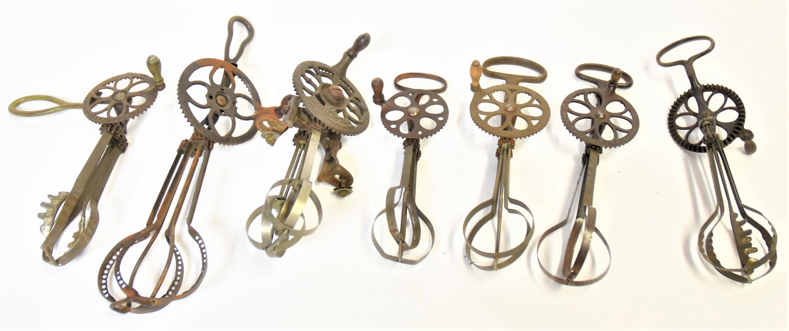 Early Egg Beaters: Lot of seven different egg beaters, including the following signed examples: Holts Egg Beater & Cream Whip; Hutchinson; Cyclone; Improved Taplin's Dover Pattern; and more. Condition Fine to Very Good.