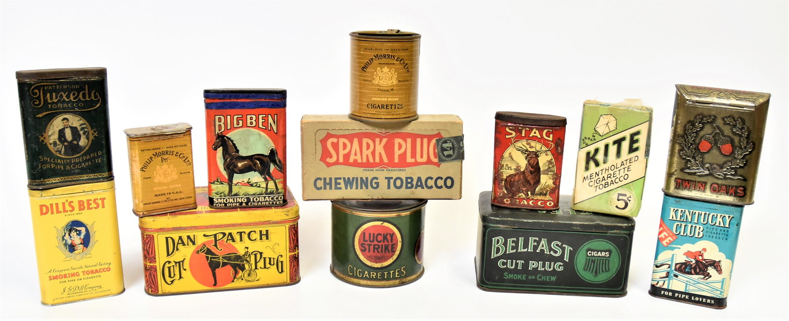 Lot of Tobacco Tins Plus: Lot of 13, including 11 chromolithographed tins such as Dill's Best; Tucedo; Twin Oaks; Big Ben; Stag; Kentucky Club; Belfast; Dn Patch; Lucky Strike; Philip Morris (2); and two in paper and card stoc