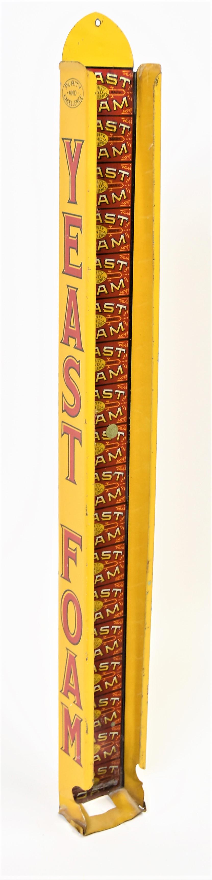 Yeast Wall Rack: Chromolithigraphed tin with illustrations of 18 packages of yeast foam on back were they would be stacked in wall mount display case, Yeast Foam on each side, 3 x 1 3/4 x 27" high. Condition paint cir