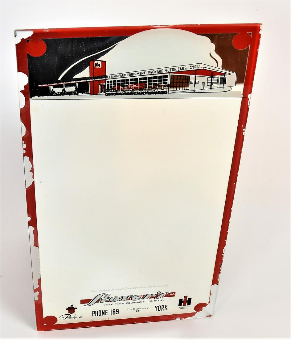 International Harvester Mirror: Chromolithographed with dealership building at top and Stover's York Farm Equipment Company along bottom. They also sold Packard, Deering, & McCormick, 6" x 11" high. Condition Loss of red margin, els