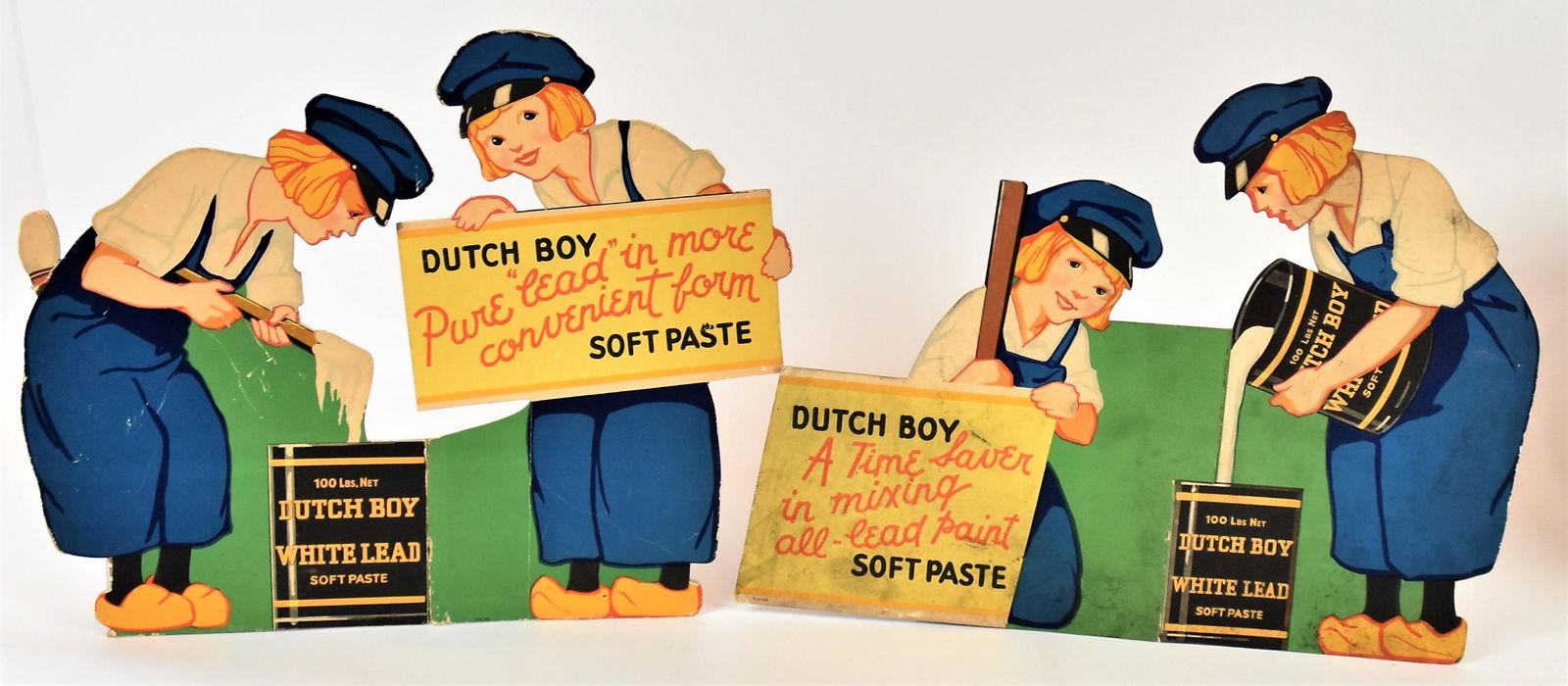 Dutch Boy Card Stock Display: Chromolithogaphed 3-D with two Dutch Boys mixing paint, one holding sign reading: Dutch Boy Pure lead in more convenient form Soft Paste, 18 x 15" high. Condition minor scratches, Very Good.