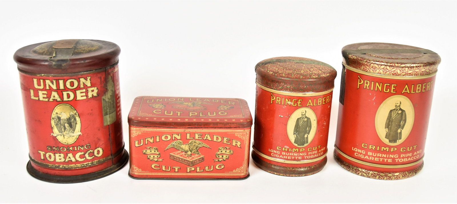 Union Leader & Prince Albert Tobacco Tins: Lot of four, all chromolithographed tin including rectangular Union leader with hinged lid, 6 x 4 x 3" high; plus cylinder from Union Leader, double sided with domed friction fitted lid, 5" diameter x