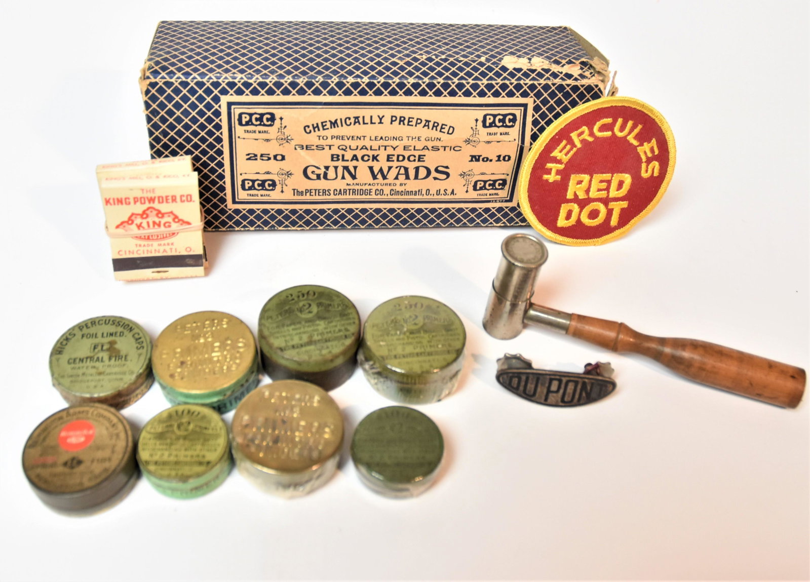 Peters & Other Percussion Caps Plus: Lot of 15 items including six stamped brass and chromolithographed tin primer boxes from Peters Cartridge Co., 1 ½ to 1 ¼” diameter; plus one chromolithographed Remington tin percussio