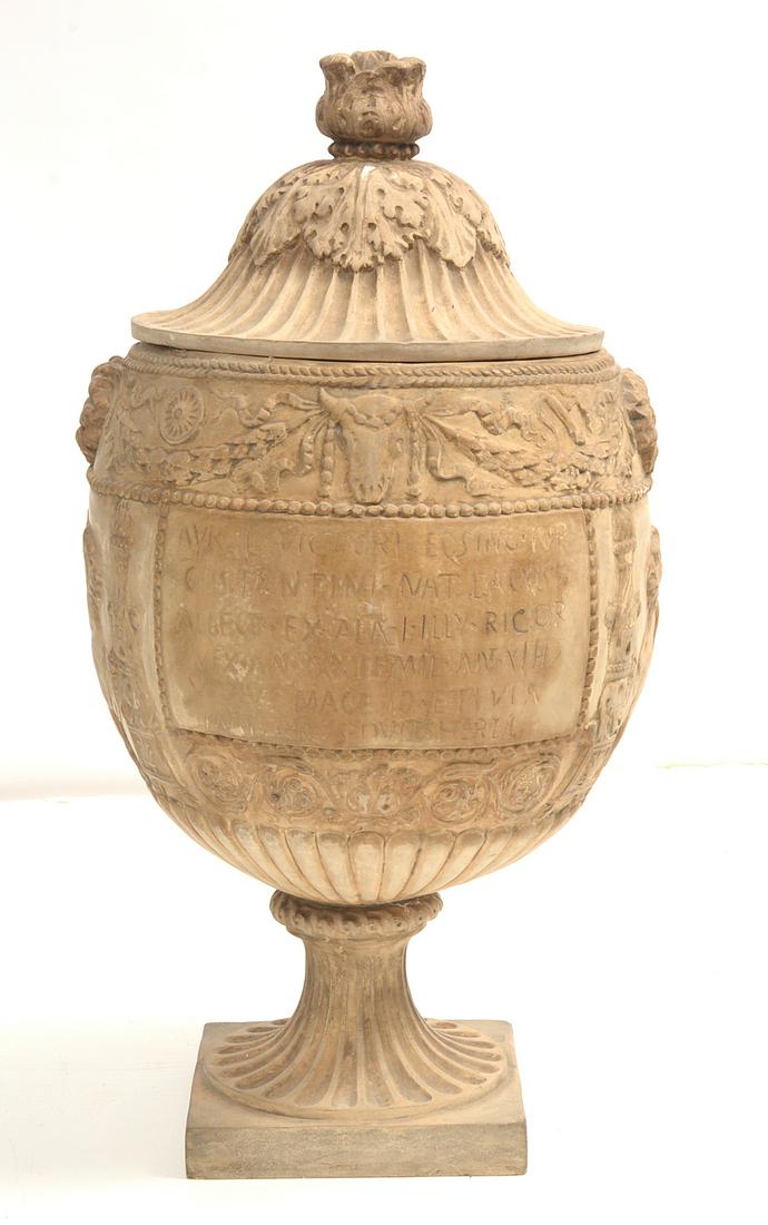 Terra Cotta Urn: Italian with acanthus leaf decorated lid, over panel with floral swags ribbons and cattle skulls, over paneled inscription in Latin, flanked by griffins and floral, over stop fluted bottom, attached t
