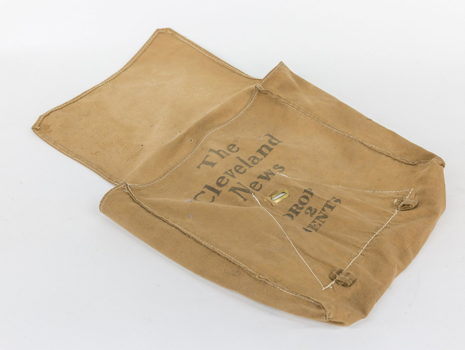 Cleveland Self Serve Newspaper 2 Cents Canvas Bag: Machine sewn with black stenciled: The Cleveland News Drop 2 Cents with brass slot on front, circa 16” square. Condition minor wear Very Good.