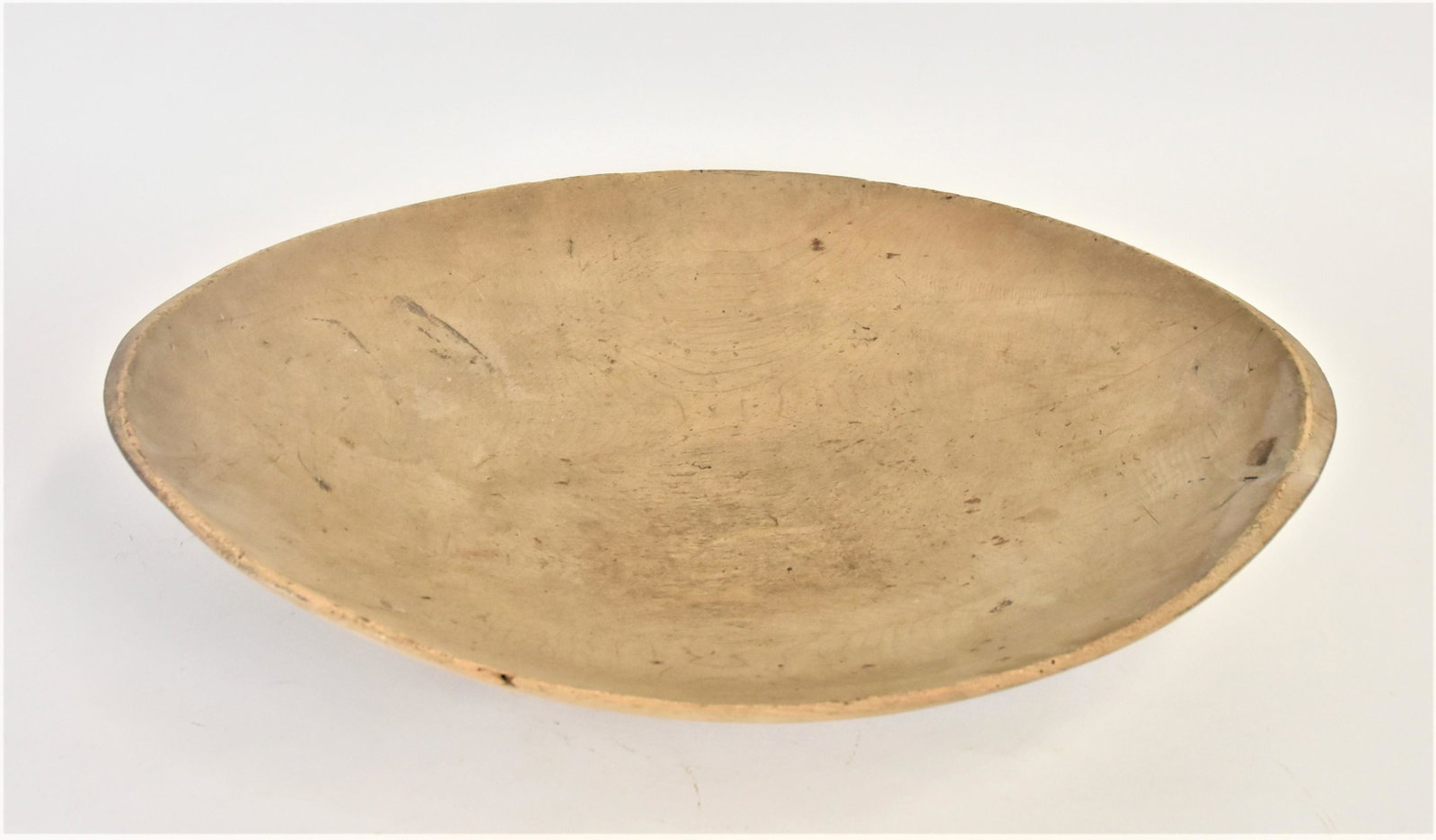Early Oval Wooden Bowl: Circa 1850-70, likely white pine with nice old scrubbed patina, 22 ½ x 15 x 5” high. Condition minor chip on lips, Very Good.
