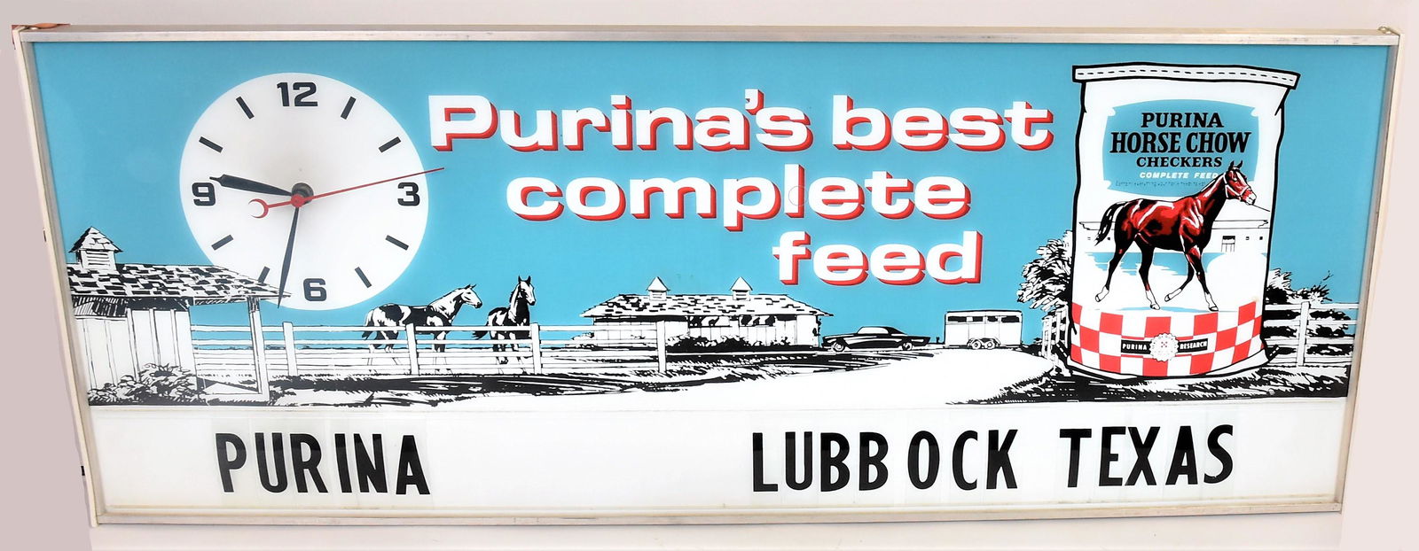 Lighted Purina Lubbock Texas Hanging Clock: Clock on left with Arabic numerals, bag of Purina Horse Chow on right, horse ranch in background and text: Purinas best complete feed. Lower section has space for snap in plastic letters with Purina L
