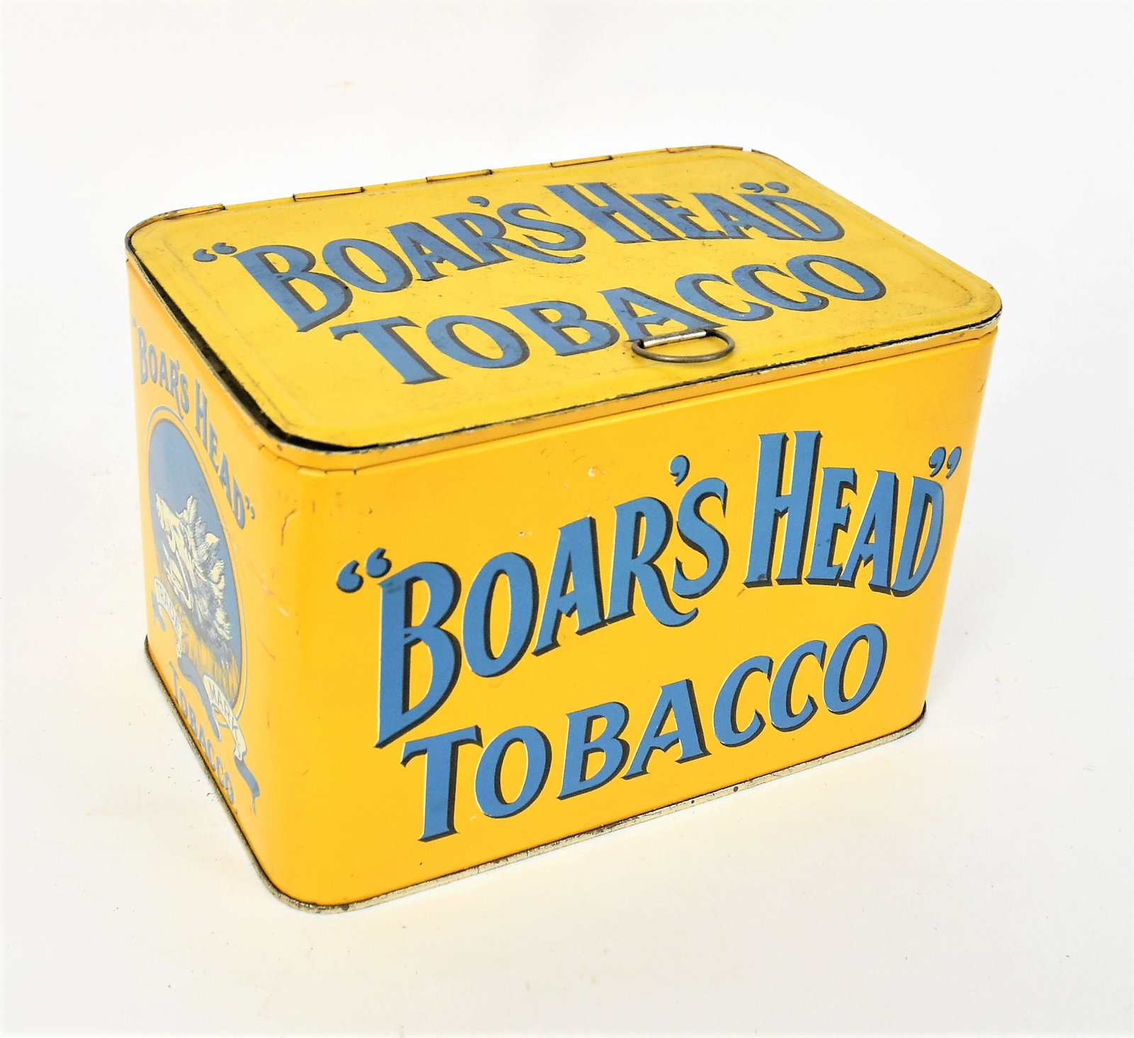 Boars Head Tobacco Tin: Chromolithographed with boars head on each end and text as above on lid front and back, hinged lid with ring handle8 1/2 x5 3/4" deep & high. Condition Paint circa 98% Fine.
