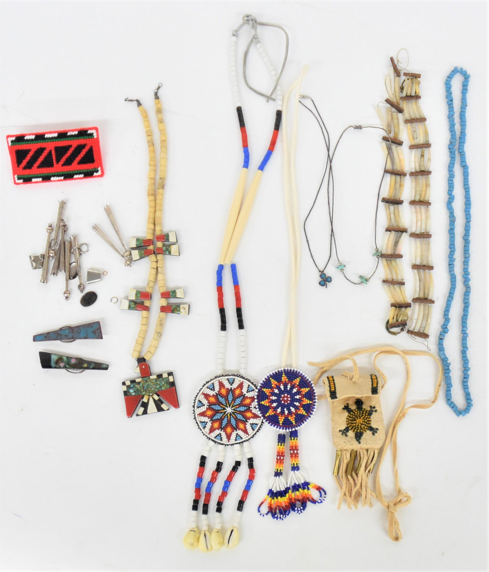 Native American Jewelry: Lot of 10 plus, including a very nice Santa Domingo Tunderbird necklace, inlaid colored and black bakelite, bone and turquoise, circa 1930's13" long with coin silver clasp; plus eight unmounted coin o