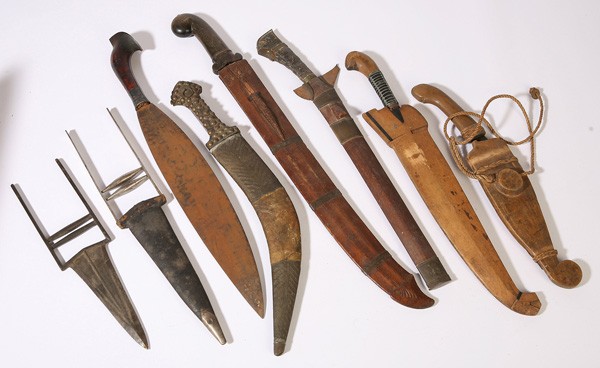 EIGHT 19TH CENTURY ETHNOGRAPHIC EDGED WEAPONS: Including a fine Rosewood grip bolo with silver collar, 22" plus two katars, one with leather sheath, 14" and 17.5" long; plus a nice serpentine bladed Kris with scabbard, 21" long; plus a P.I. tribal