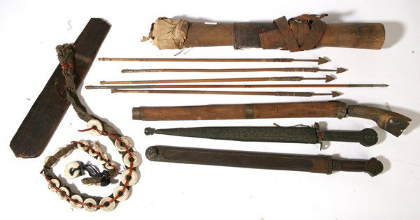 TEN ETHNOGRAPHIC EDGED WEAPONS: Includes two South Asian Kindgal short swords with scabbards, both 20.5" long; plus a P.I. tribal sword in scabbard with horn handle 25" long; plus 4 P.I. tribal arrows and wooden quiver; plus New Gui