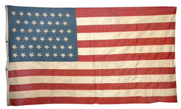 46 STAR PRINTED U.S. FLAG: With canton pattern of 8-7-8-7-8-8 cotton machine sewn fly and canvas hoist with 4 brass grommets. 32" x 58".