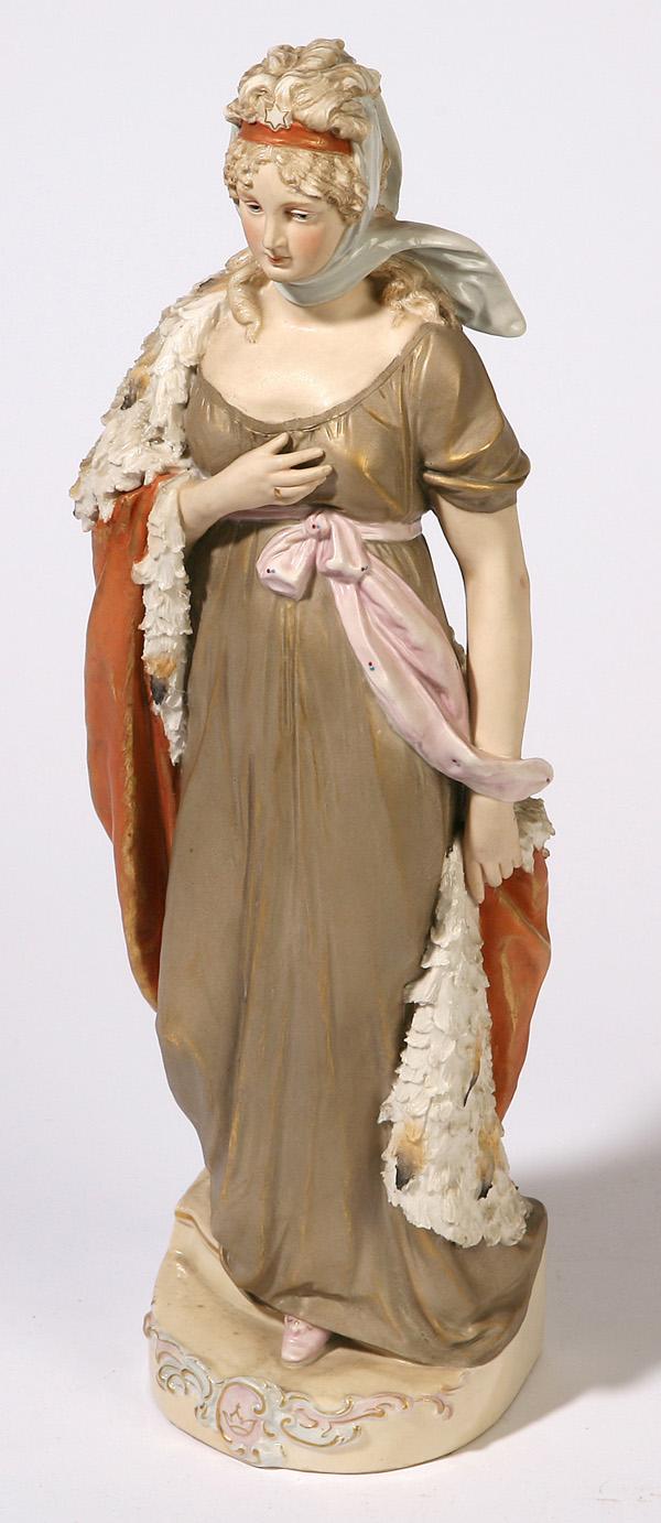 LOVELY ROYAL DUX PORTRAIT FIGURINE: Of a royal princess wearing a classical style gold dress and feathered robe with pink raised Royal Dux mark on base and numbered "248". 12.5" high.