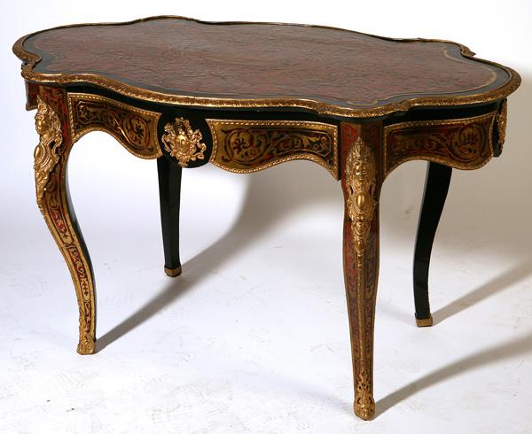 ORNATE BOUILLE LOUIS XV STYLE PARLOR TABLE: Circa 1850 and likely French, ebonized wood with extensive brass ormolu mounts including masks, cabriole legs and single drawer. Some restoration to shell and replaced drawer veneer. 29" x 52" x 30" h