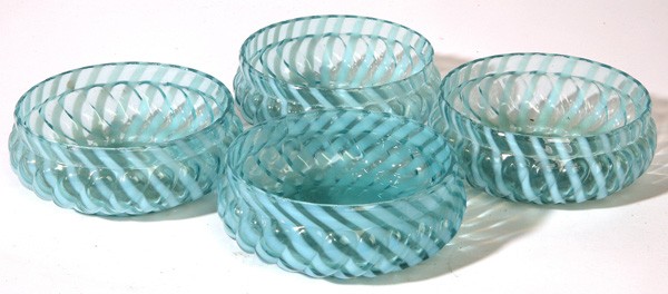 FOUR VICTORIAN BLUE OPALESCENT FINGER BOWLS: Light blue hand blown into mold with swirled ribs and white ribbons, fire polished lips. 4" x 2" H.