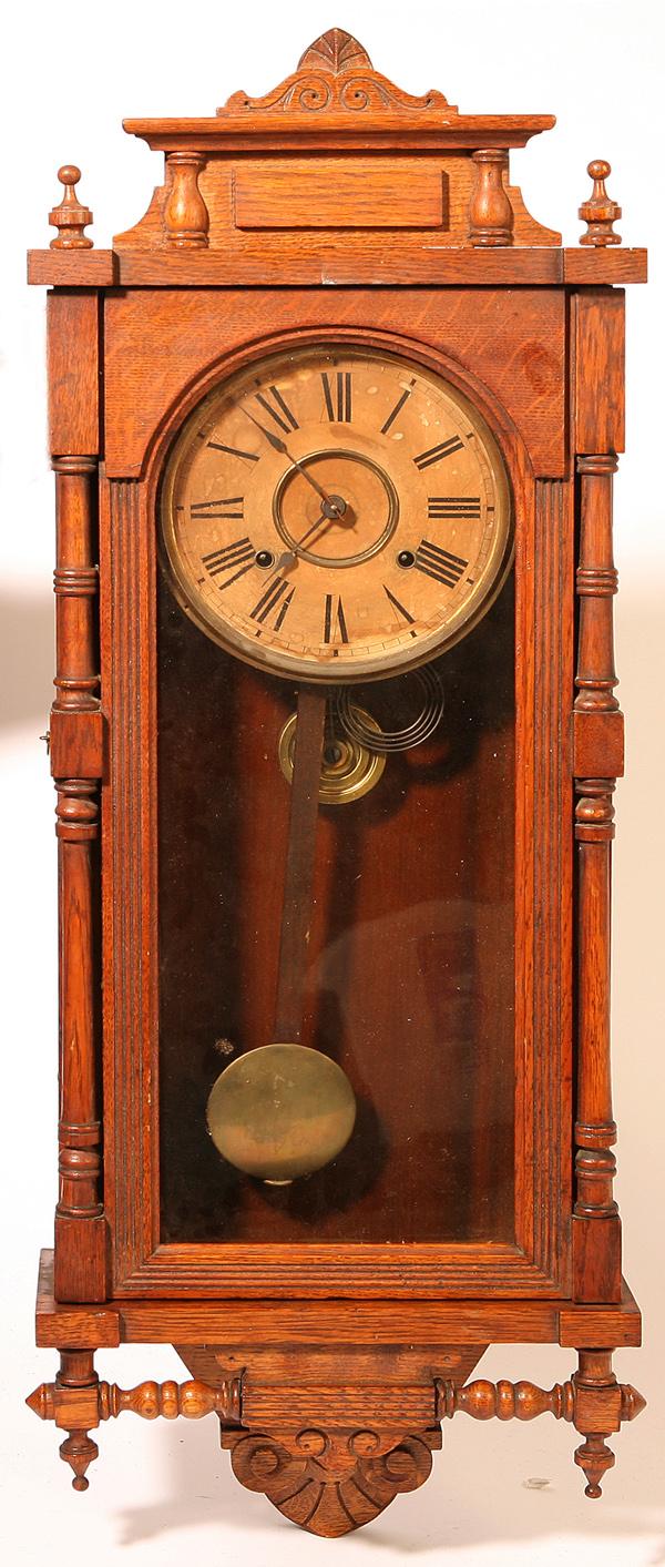 ANSONIA OAK QUEEN ELIZABETH REGULATOR CLOCK: With brass spring driven time and strike movement marked "Ansonia Clock Co. New York, Patented June 19, 1882", all original. Dial toned, otherwise excellent. 37" high.