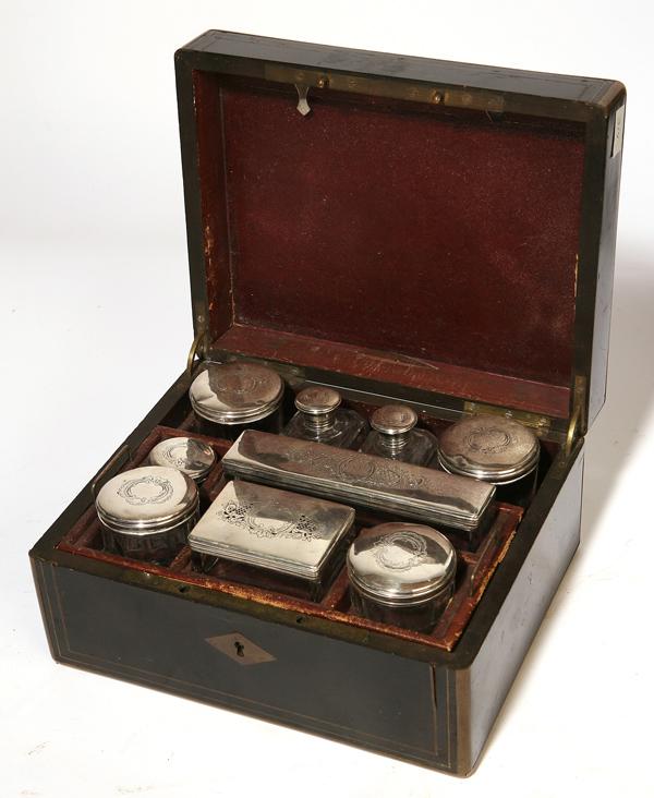 FINE INLAID TRAVELING TOILETRY CHEST W/CUT GLASS B: Ebony with inlaid brass and mother-of-pearl and other shell, opens to reveal fitted interior with 8 sterling lidded cut glass bottles of various sizes. A shelf lifts out to reveal tray. This tray also