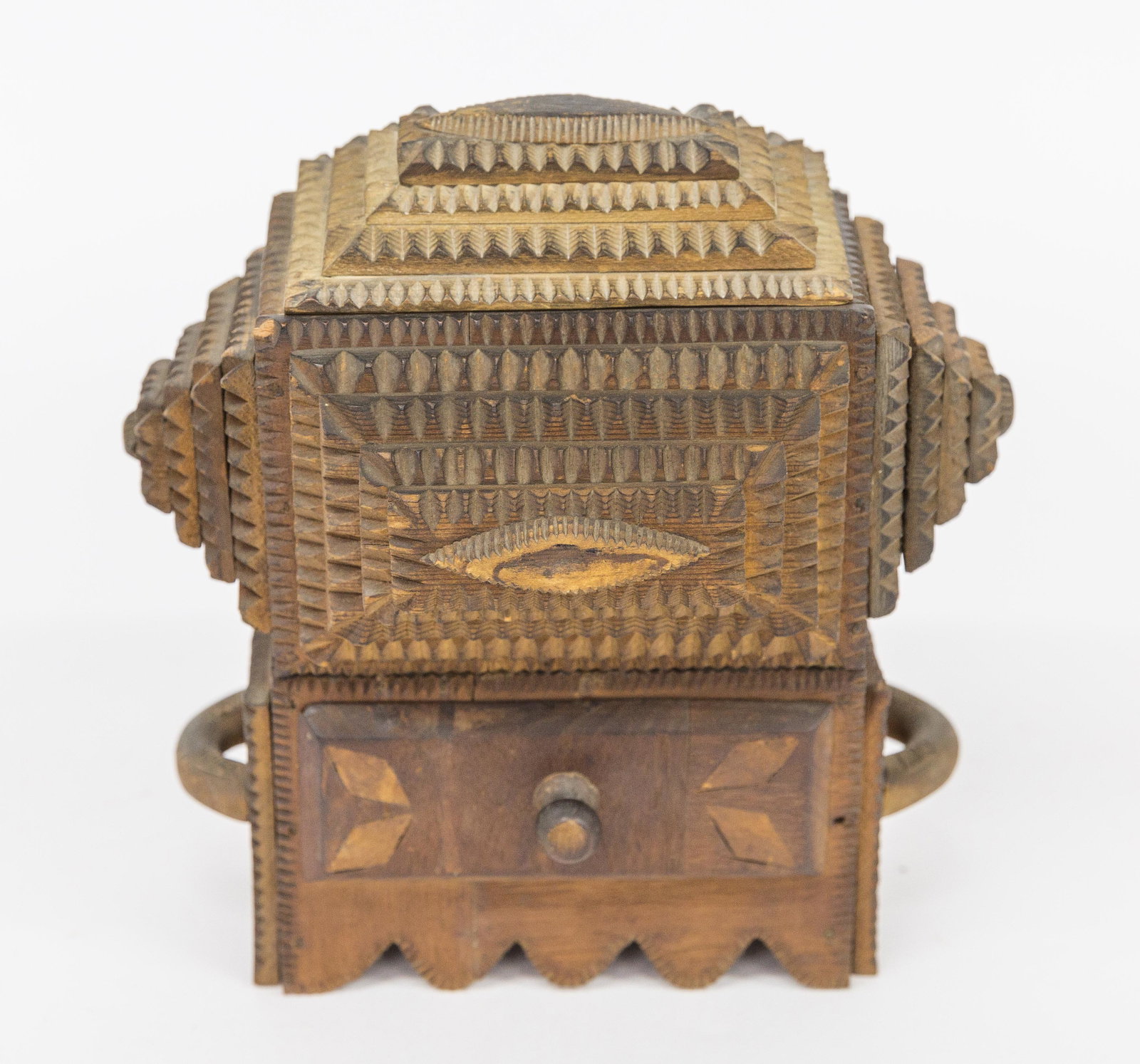 Tramp Art Sewing Box: American circa 1890 with upper part having stepped chip carving on lid and sides with sliding lid, revealing interior with lift out shelf with compartment below. Lower section with inlaid drawer with 