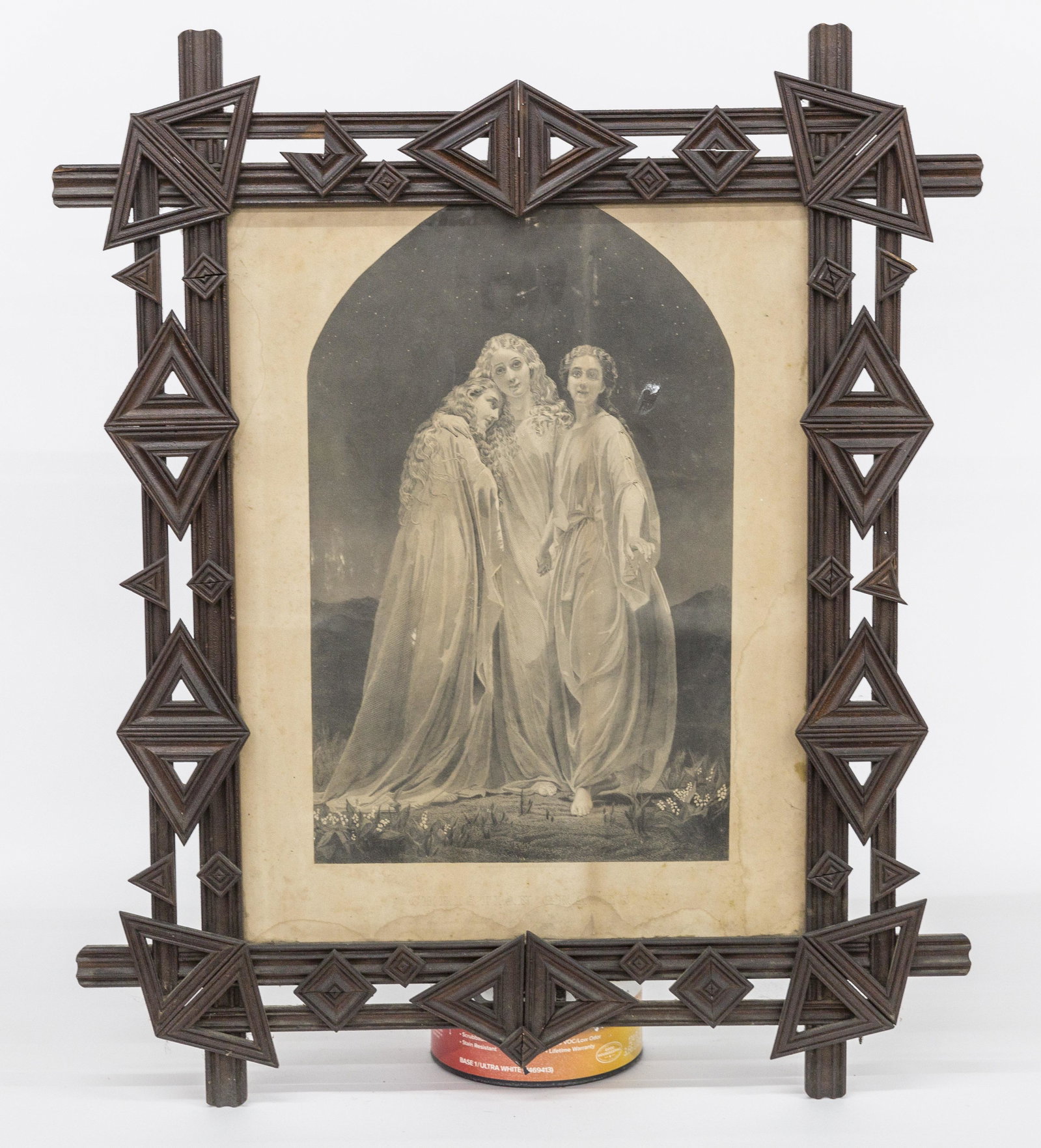 Tramp Art Frame: Circa 1880-90 chip carved in original dark varnish finish with lithograph entitled Christian Graces, 26 1/2 x 31 1/2". Condition minor edge chips,litho with damp stains, VG.