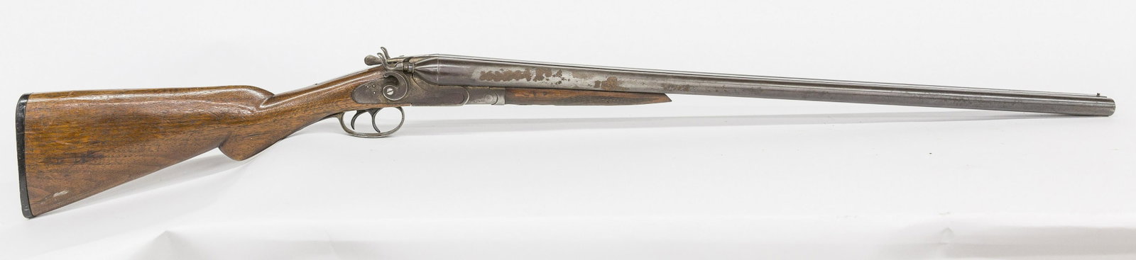 Essex Double Barrel Shotgun: Percussion, marked on left side of frame, Essex Warrd, 12 gauge with Damascus steel central rib, brass front bead sight, 29 3/4" long round barrels, serial number 370220 on barrel and frame, walnut st
