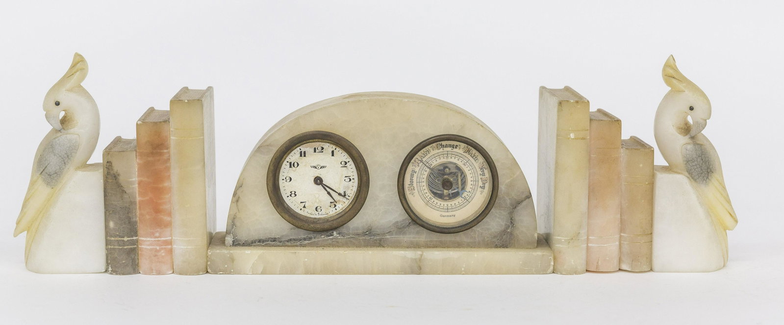 Alabaster Bookends & Clock/Barometer: Lot of three, including pair of shaded graduated stack of three standing books bookends, each 2 1/4 x 3 x 4" high; plus pair of cockatoos bookends, 2 x 1 1/2 x 5" high; and arch top clock and baromete