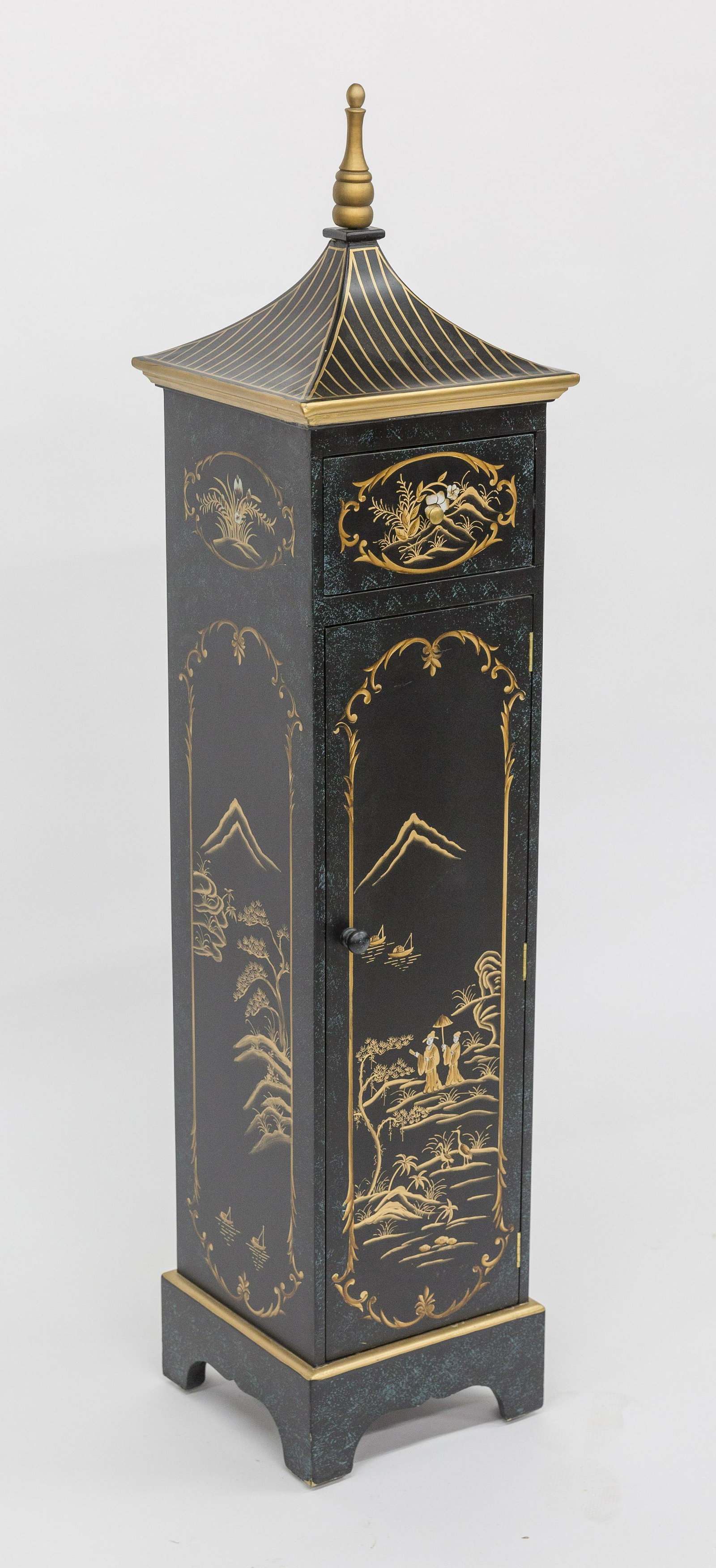 Lacquer Decorated Chinese Cabinet: Circa 1980 with landscapes on three sides with figures on front, top pagoda style peaked roof, over single drawer, over door with four shelves, bracket base with cut-outs, 12" square x 53" high. Condi