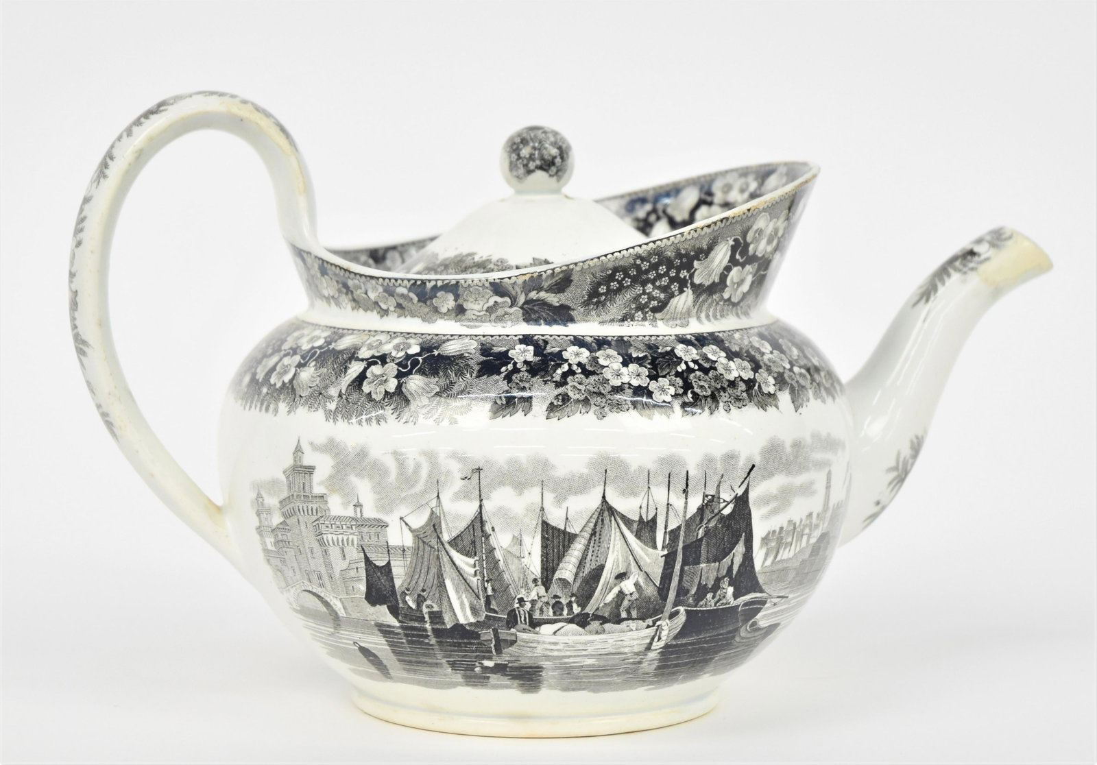 Wedgwood Black Transfer Teapot: Circa 1800 with Venetian harbor scene with floral borders and lid, stamped Wedgwood, 10 1/2 x 5 x 6 1/4" high. Condition small flake on edge of lid, else Fine.