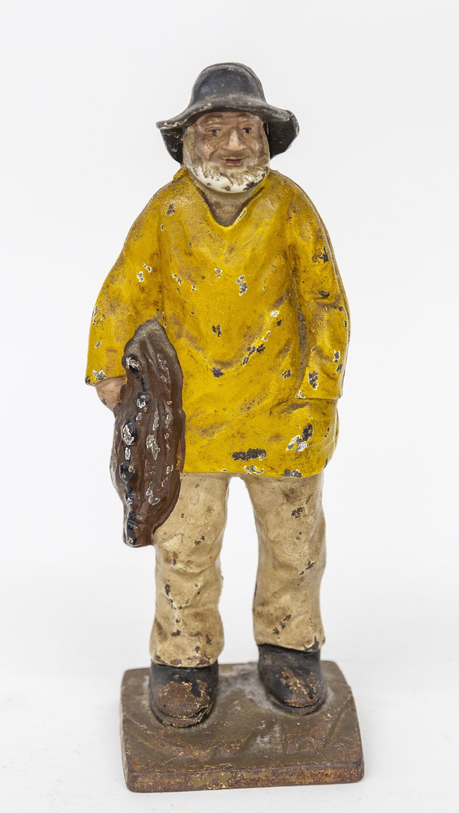 Hubley Maine Fisherman Door Stop: Cast iron in original polchrome painted finish, 4 x 3 3/4 x 11 1/2" high. Condition paint circa 95%.