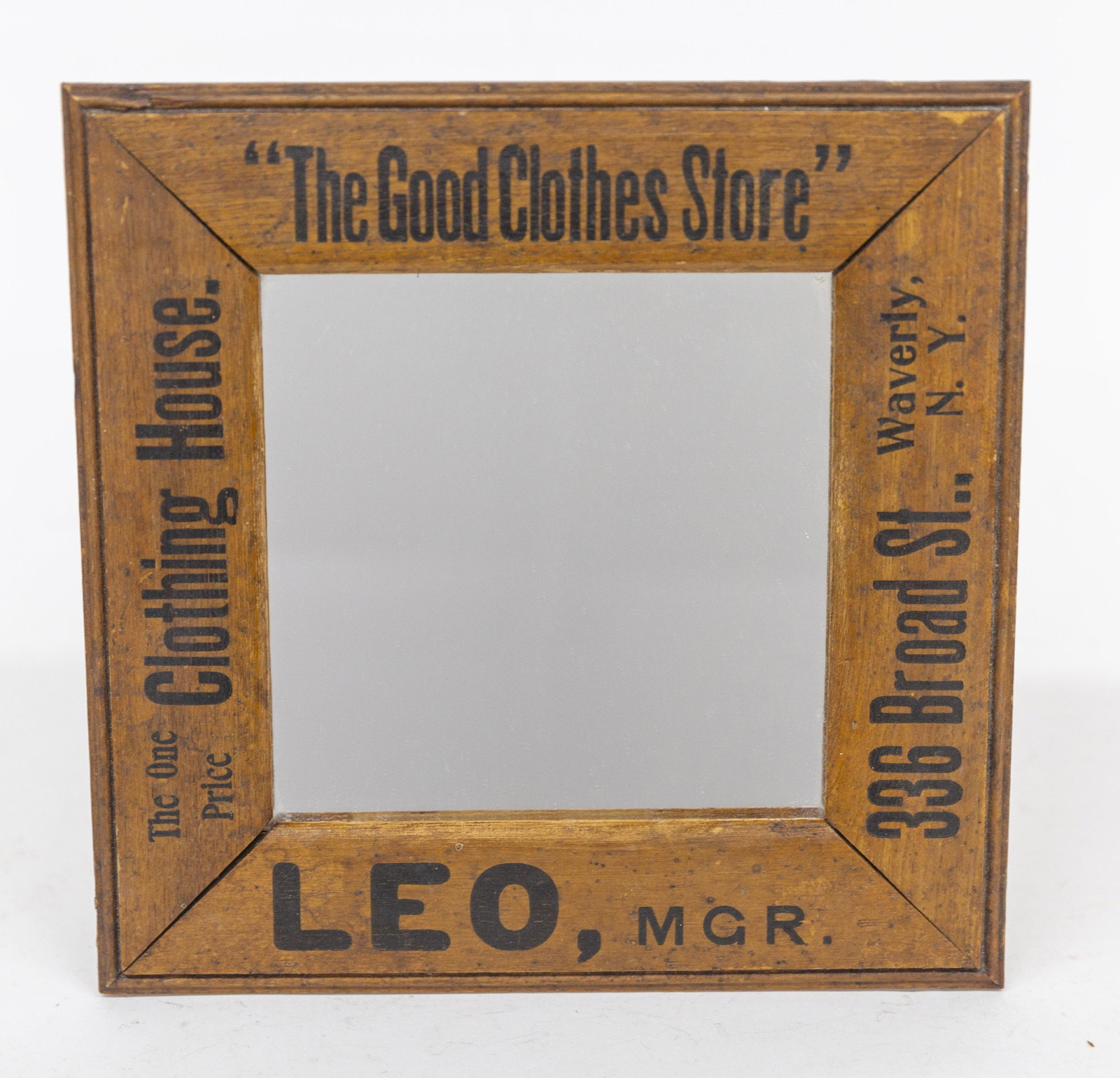 Waverly New York Advertising Mirror: Ash with black stenciled text on all fur sides of frame reading from top clockwise: The One Price Clothing Store/The Good Clothes Store/336 Broad St., Waverly, N.Y./LEO, MGR., 9 3/4" square. Condition