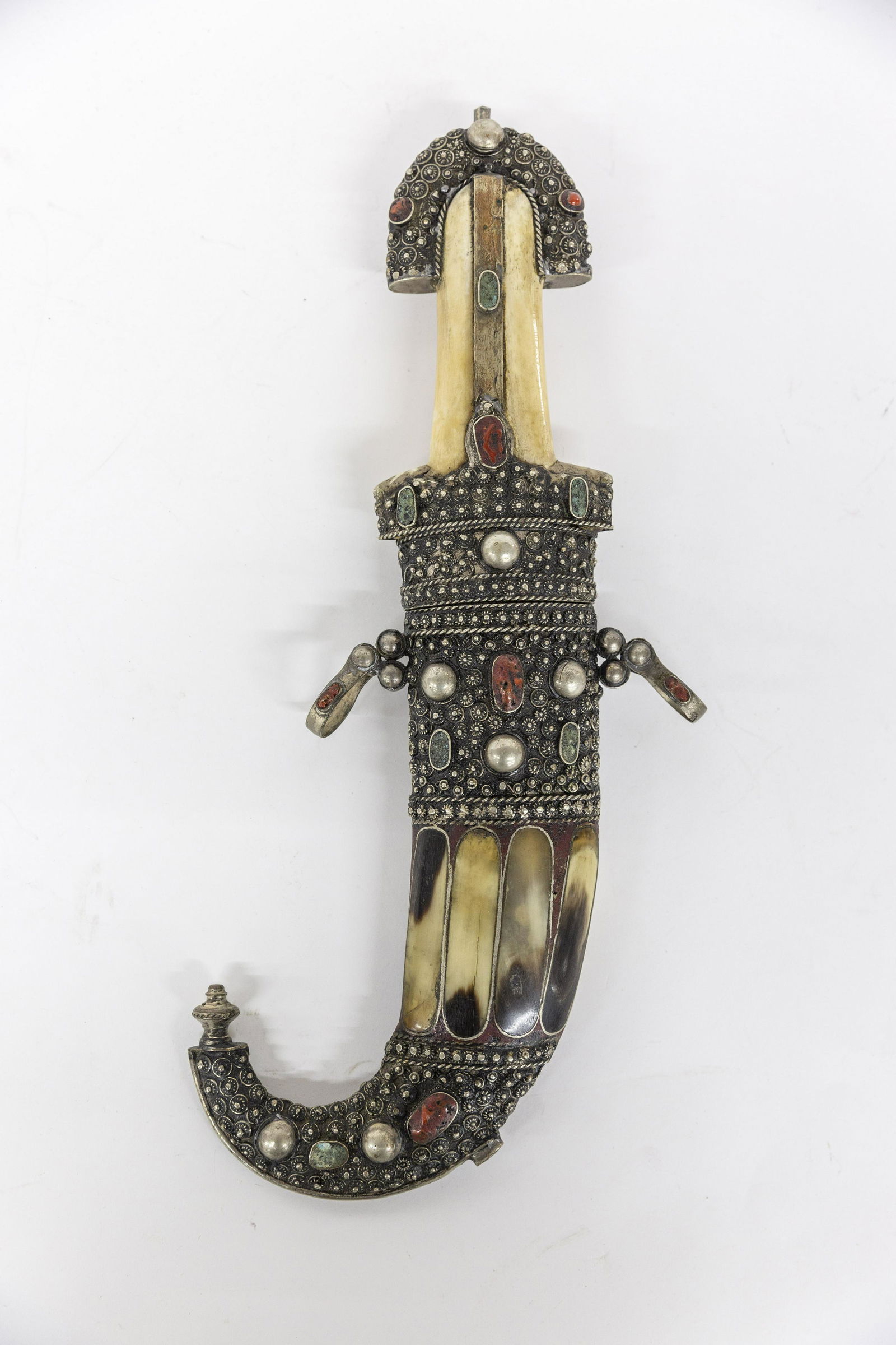 Moroccan Jambiyas Silver Mounted Knife: In matching sheath, both set with semi-precious stones wit bone grip and antler inlay on sheath, with 9" long curved single edged steel blade, circa mid to late 19th century, total length in sheath 17