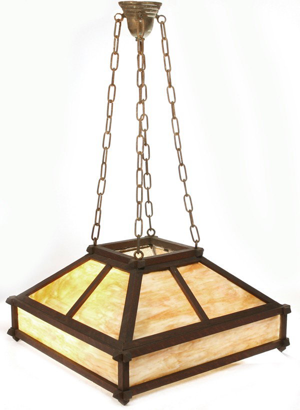 ARTS & CRAFTS (MISSION) HANGING CHANDELIER: Supported by chains with twelve carmel slag glass panels; very good original dark brown finish. Very good condition. 38" H with chains. Shade 12" H x 24" W x 24" D.