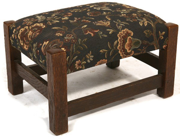GUSTAV STICKLEY FOOTSTOOL #299: Original finish with light overcoat. Signed with branded mark. Good condition. 9" H x 16" W x 12" D.