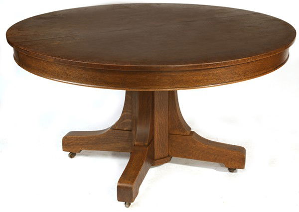 ARTS & CRAFTS (MISSION) DINING ROOM TABLE: Fine round extension table with long corbel supports to base; with four 9" leaves. Original red brown finish. Very good condition. 30" H x 54" dia.