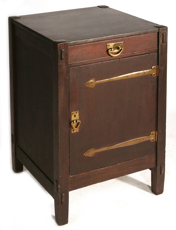 EARLY GUSTAV STICKLEY SAFE CABINET: With spade strap hinges and V pulls. Original dark finish. Signed with large red early decal. Wood is mahogany. Bruises to wood on door where hinges meet the strap. Light scratches to top. Safe missin