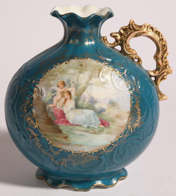 ROYAL SAXE PORCELAIN EWER: Turquoise blue ground with paneled scene of Venus and Cupid, gilt handle, marked "Royal Saxe Germany" and "E.S." with crown. 8" high.